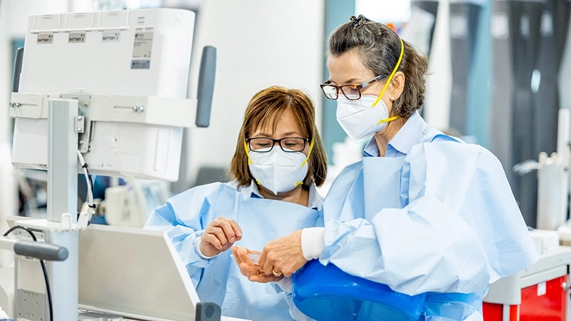two nurses sharing information 