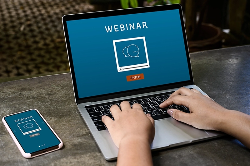 computer screen with the word webinar displayed on it
